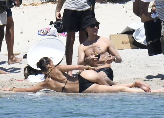 BELLA HADID in Bikini on the Set of a Photoshoot at a Beach 06/24/2020