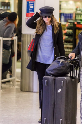 Dakota Johnson Spotted at Heathrow Airport 12/14/2017