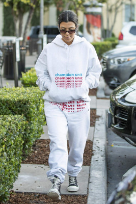 Kourtney Kardashian in Grey Sweatsuit Hoodie, Black High-Top Sneakers and Dark S